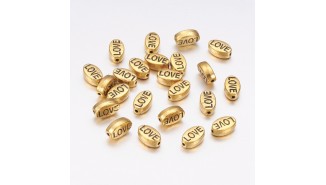 Perles ovale imprimées love en zamak doré 10x6mm