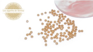 Perles verre abaques à facettes 4x3mm champagne AB
