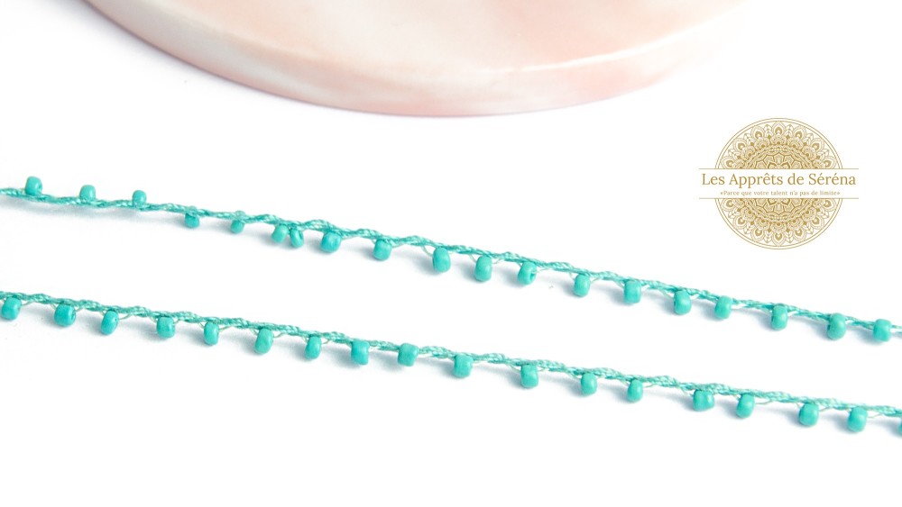Fil coton perlé de rocailles turquoises 2mm