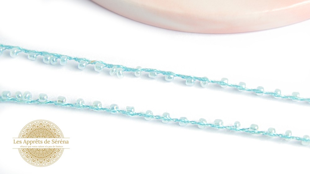 Fil coton perlé de rocailles bleu nacré 2mm